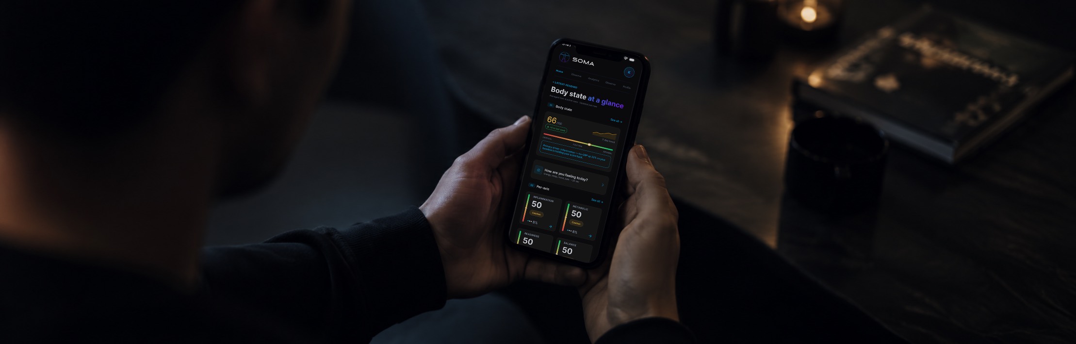 PHYSIS app showing Body State at a glance, held in hand