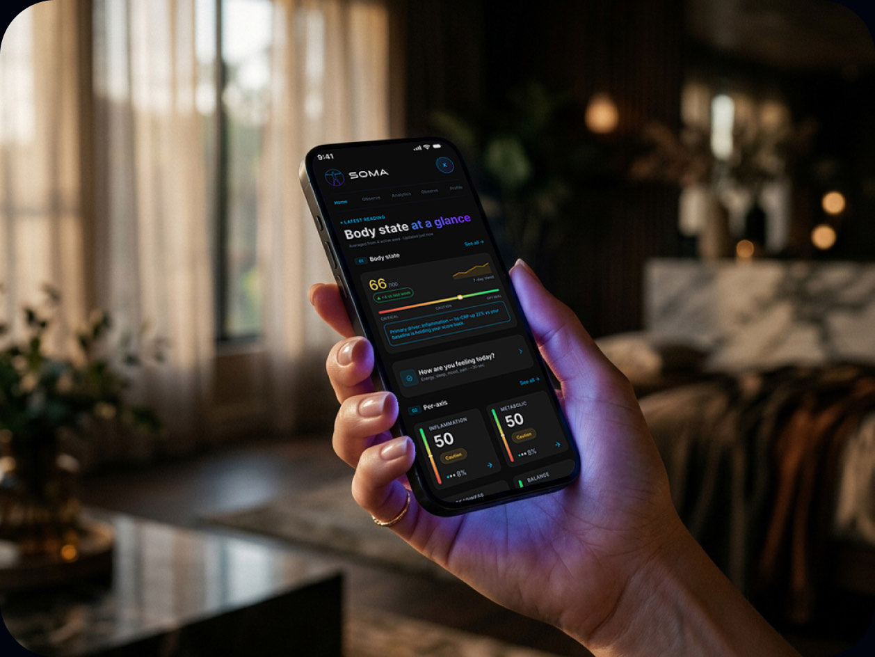 Hand holding a phone with the PHYSIS app open